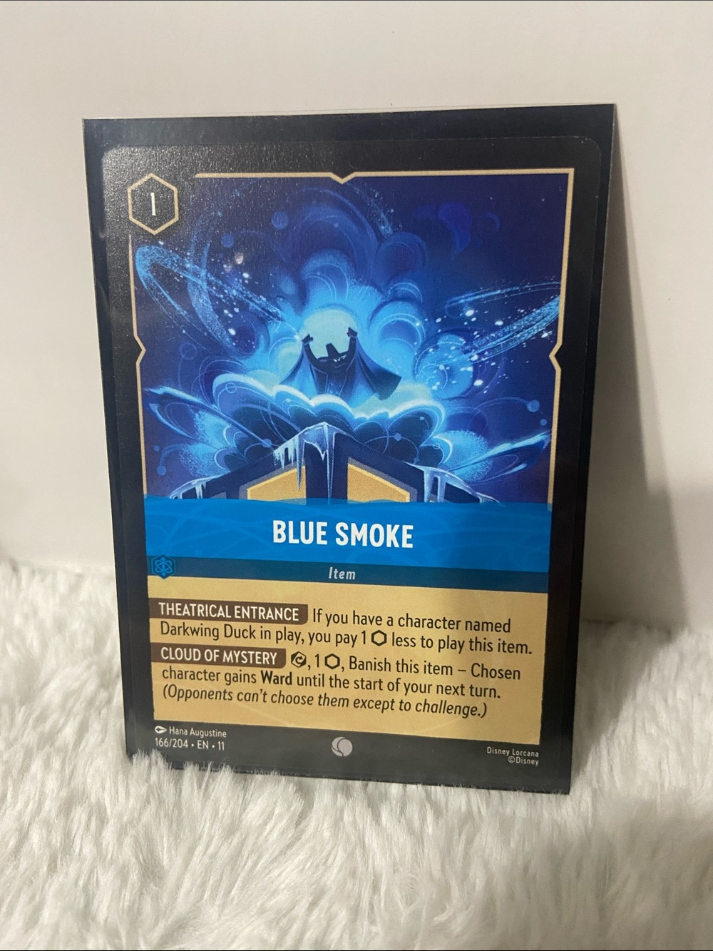 Lorcana Blue Smoke (#166/204) from the Winterspell (Set 11)